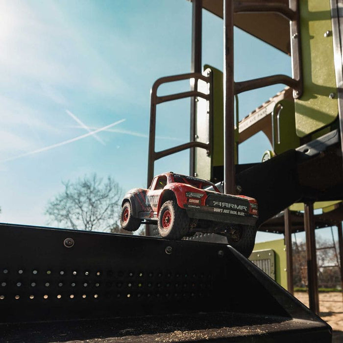 ARA2104T1 MOJAVE GROM MEGA 380 Brushed 4X4 Small Scale Desert Truck RTR with Battery & Charger, Red/Black(FOR A EXTRA BATTERY PLEASE ORDER SPMX142S30H2)