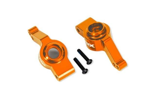 TRA9065-ORNG Traxxas Carriers, stub axle, rear, alum, left/right (orange)