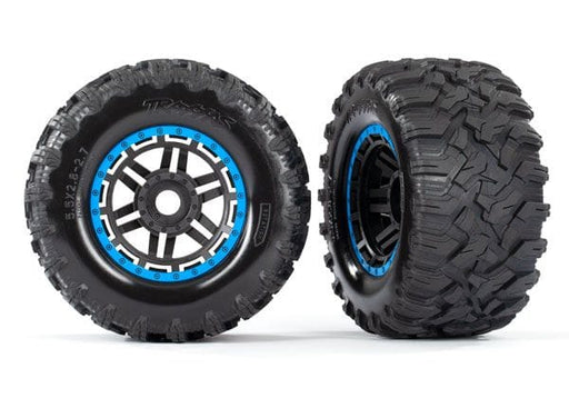 TRA8972A Traxxas Tires & wheels, assembled, glued (black, blue beadlock style wheels, Maxx MT tires, foam inserts) (2) (17mm splined) (TSM rated)