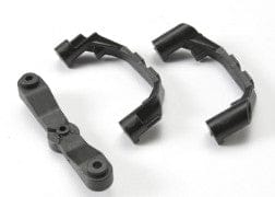 TRA5343X Mount, steering arm/ steering stops (2) (lower hinge pin retainer) (includes standard and maximum throw steering stops)
