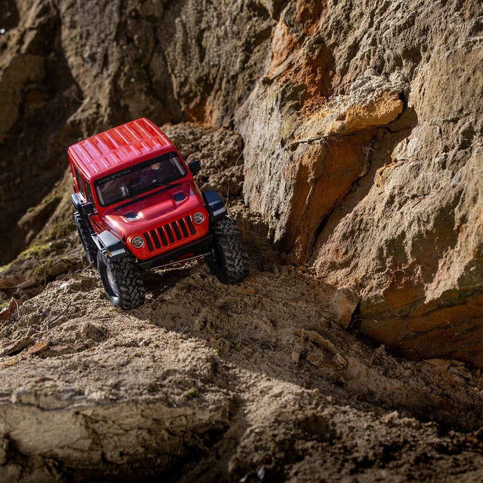AXI03003BT2 1/10 SCX10 III Jeep JLU Wrangler with Portals RTR, RED/ORANGE. on difficult roads