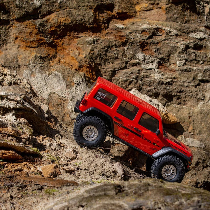 AXI03003BT2 1/10 SCX10 III Jeep JLU Wrangler with Portals RTR, RED/ORANGE. going down