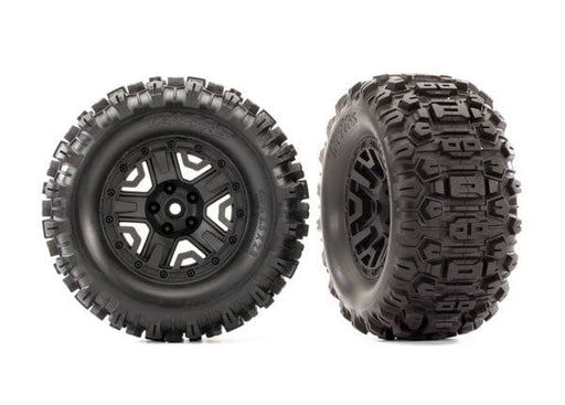 TRA6792 Traxxas Tires & wheels, assembled, glued (2.8") (Rustler 4X4 black wheels, Sledgehammer tires, foam inserts) (2) (TSM rated)