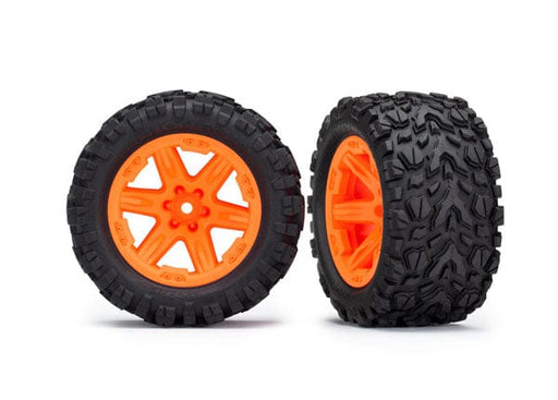 TRA6774A Traxxas Tires & wheels, assembled, glued (2.8') (Rustler 4X4 orange wheels, Talon Extreme tires, foam inserts) (electric rear) (2) (TSM rated)