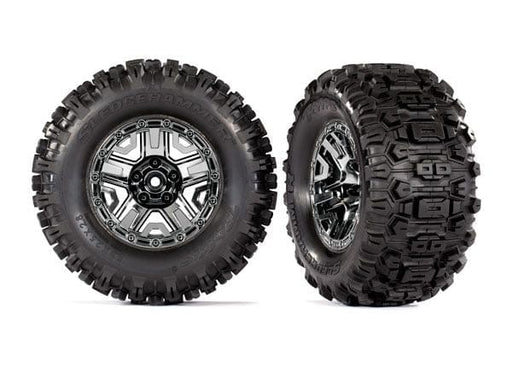 TRA9072 Traxxas Tires & wheels, assembled, glued (black chrome 2.8" wheels, Sledgehammer tires, foam inserts) (2) (TSM rated)